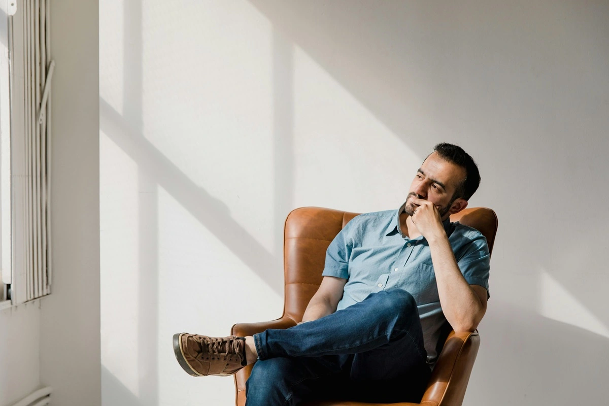 man sitting alone thinking