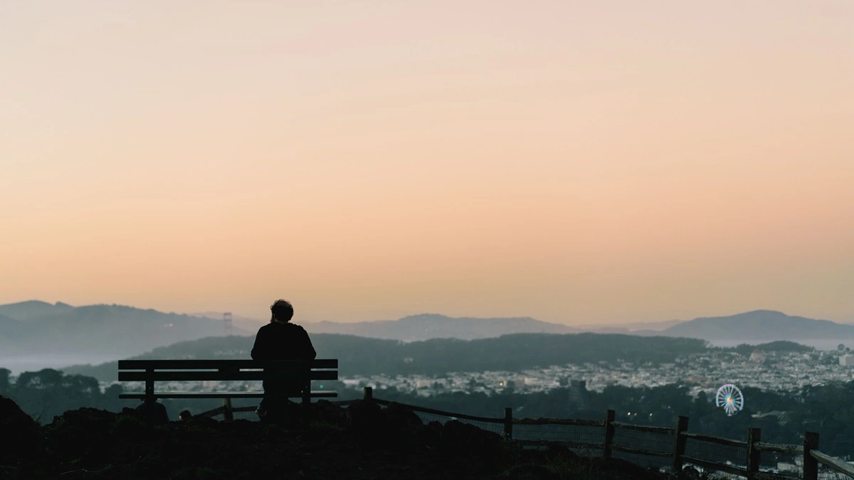Person sitting alone skyline