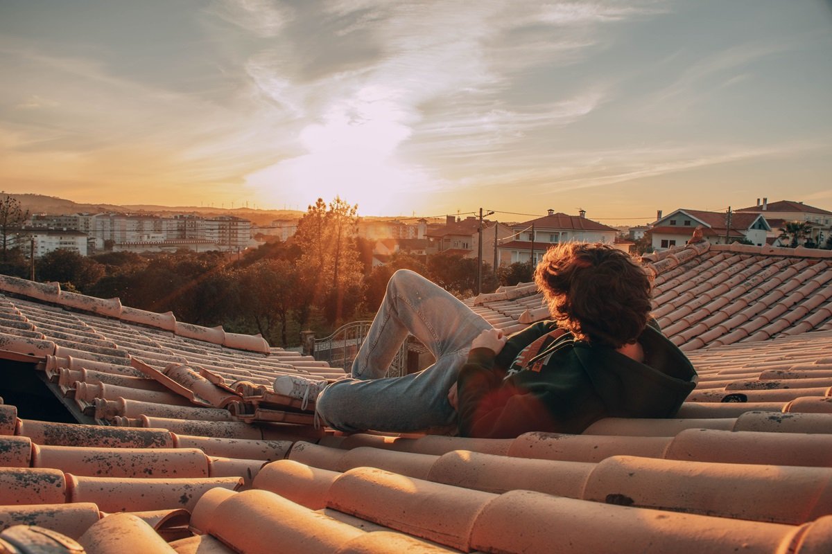 man looking at sunset
